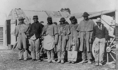 freedom seekers standing in line, donning old Union uniforms