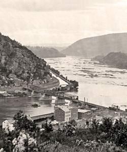 photograph Harpers Ferry overlooking town, mountain and river passing through mountains